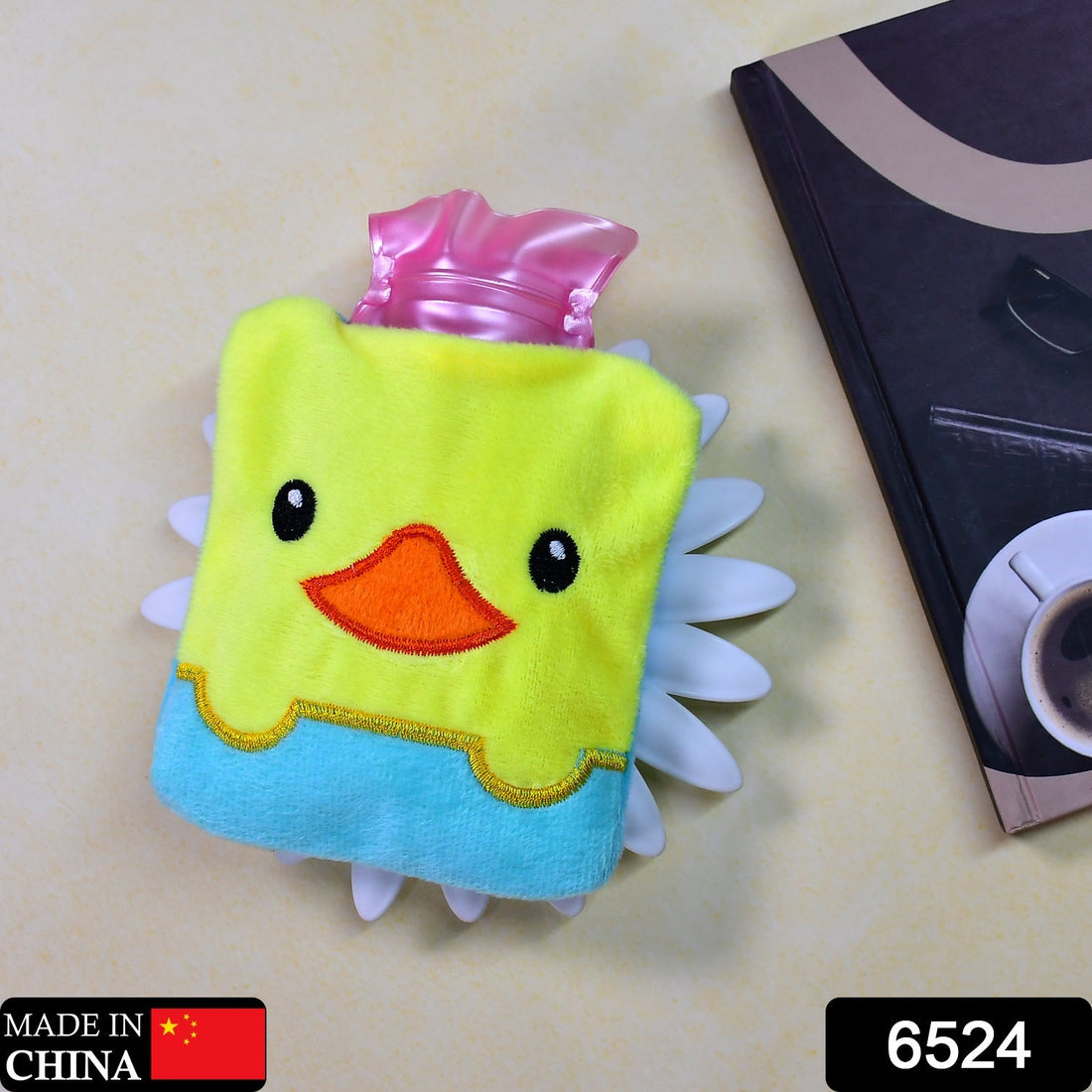 Small hot water bag with yellow duck design for pain relief.