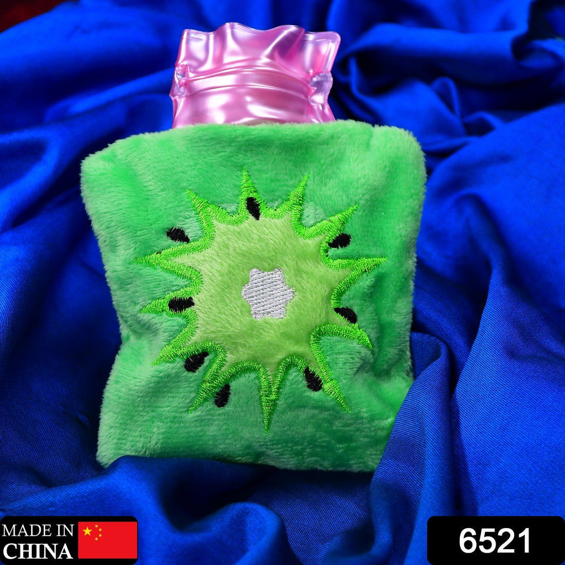 Green sun-shaped hot water bag with cover for pain relief