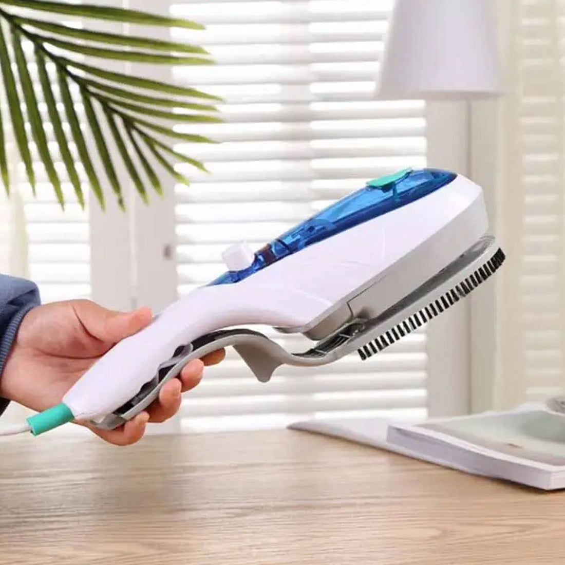 Portable handheld steam iron for travel and home