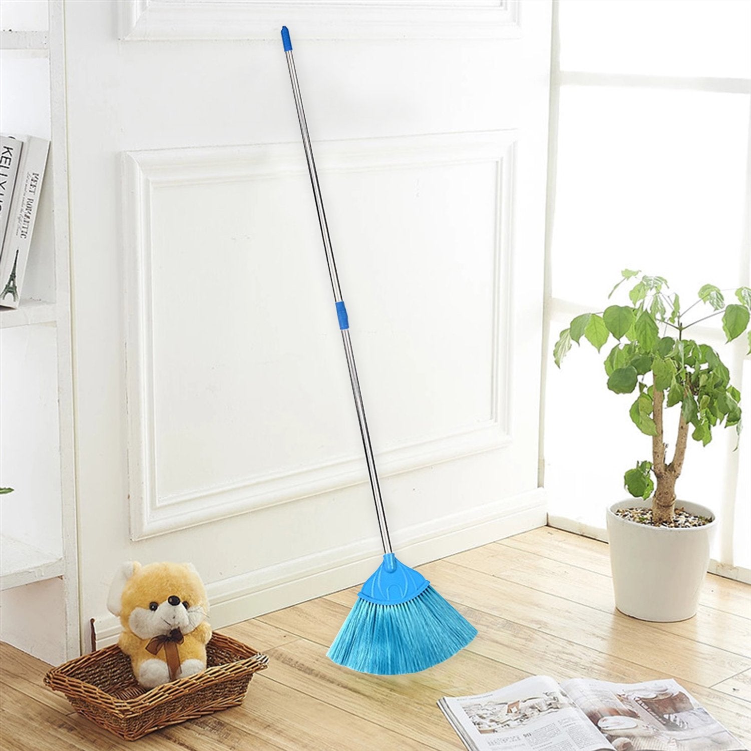 Adjustable broom stick on wooden floor