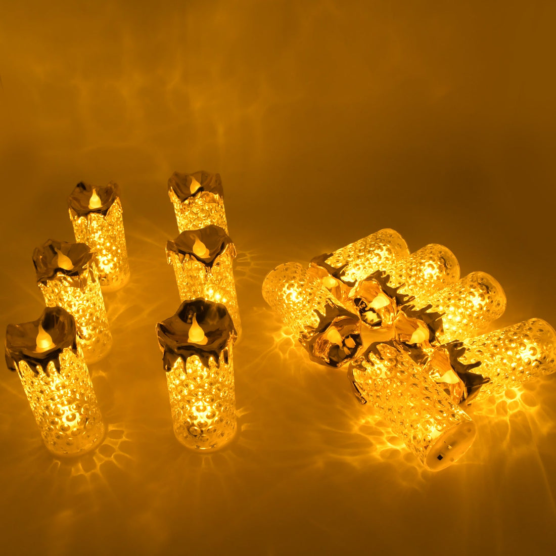 Set of gold flameless LED candles with a warm glow, ideal for home decor and special occasions.