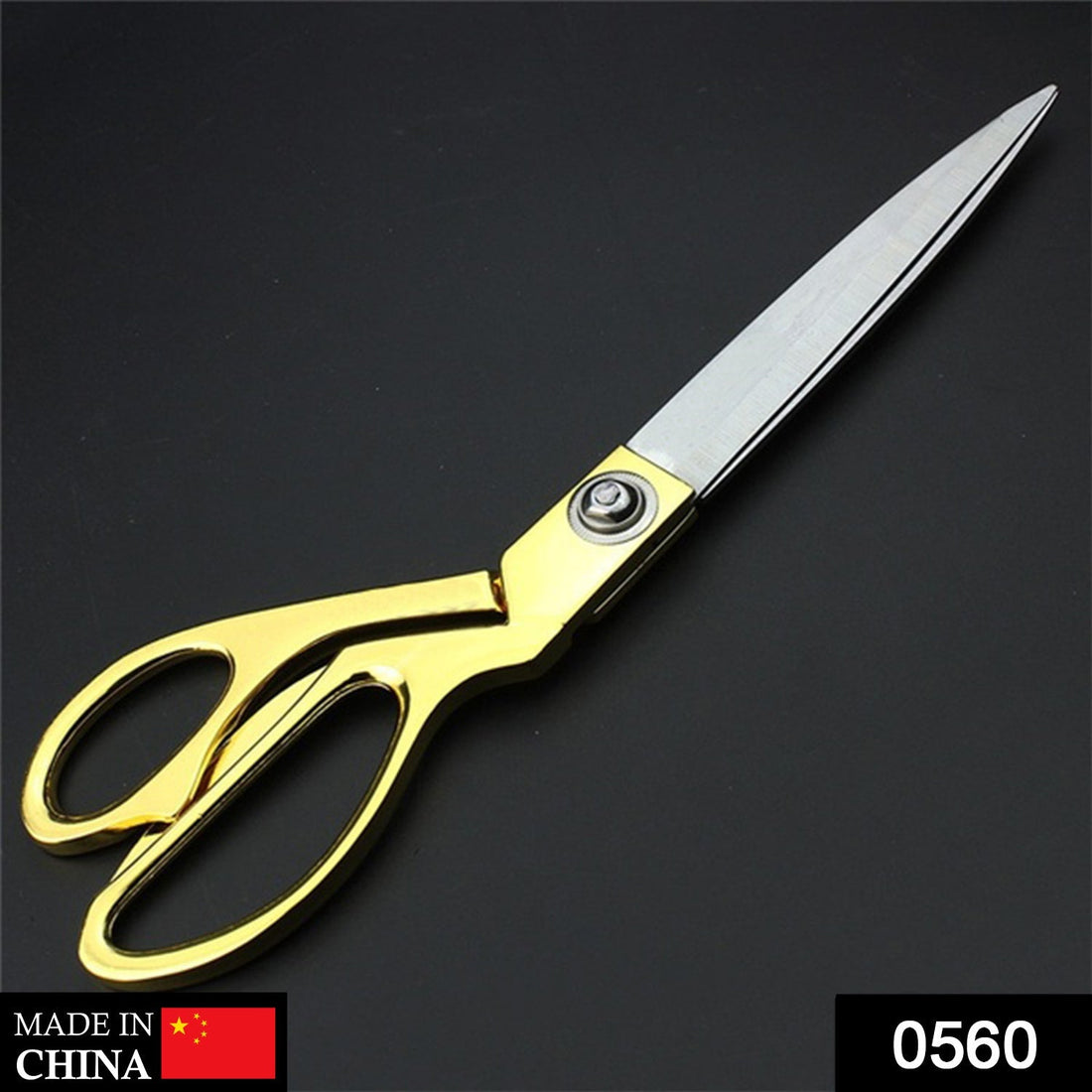 Gold-plated professional scissors for cutting cloth.