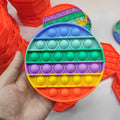 Colorful round pop it toy.