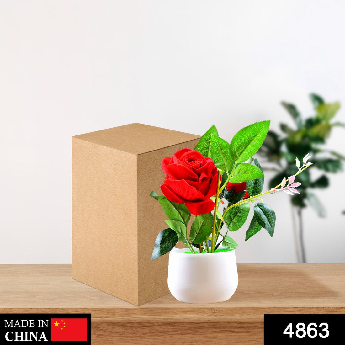 Artificial rose plant in a decorative pot