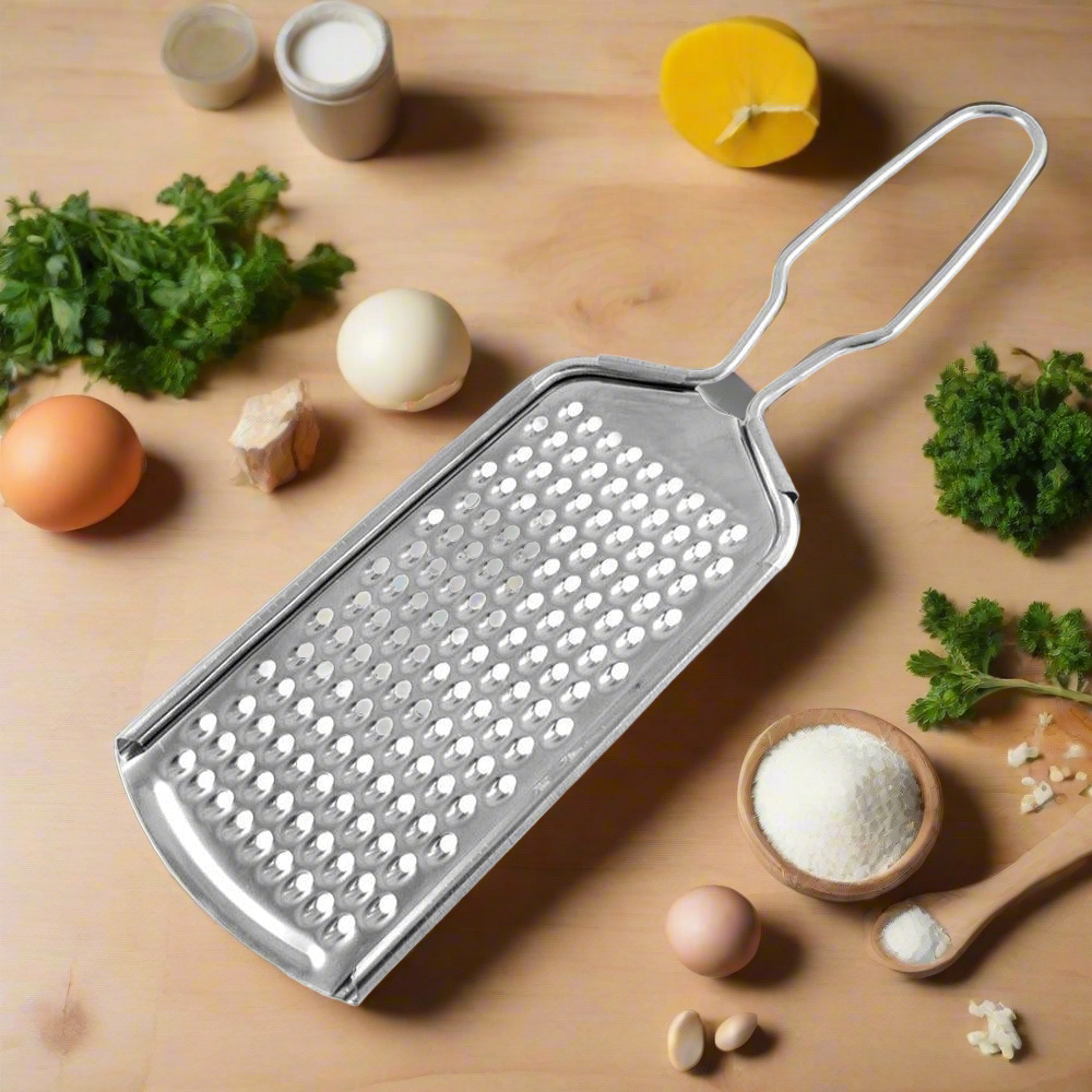 Stainless steel zester grater for zesting citrus, grating cheese, and nutmeg in the kitchen.