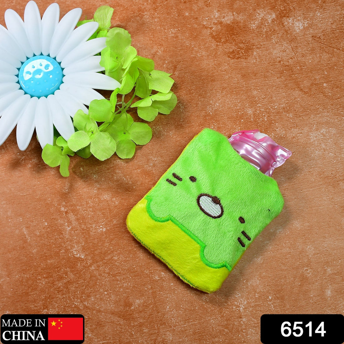 Green Kitty hot water bag with cover for pain relief and warming
