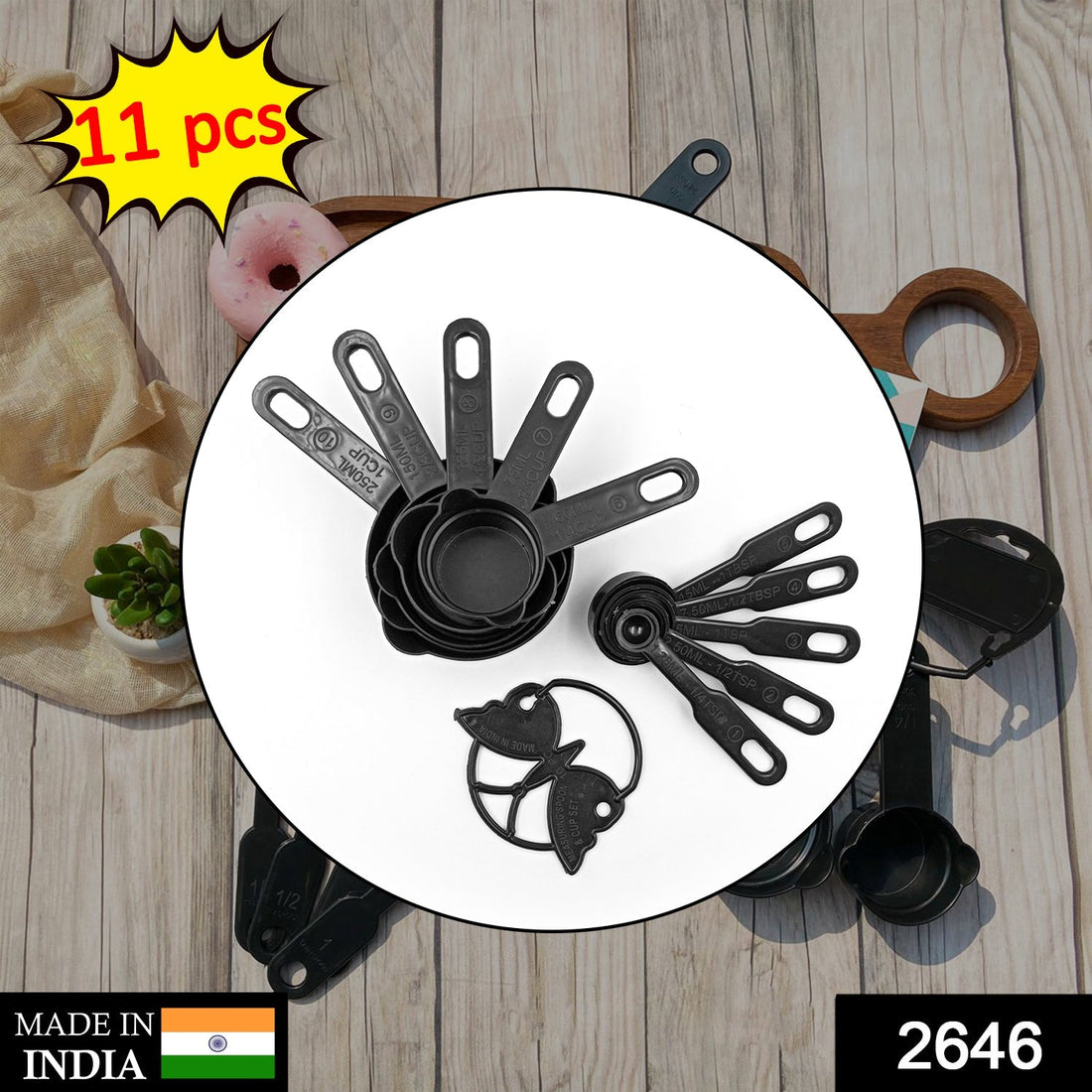 Black plastic measuring cups and spoons set with an 11-piece collection, including a butterfly-shaped holder