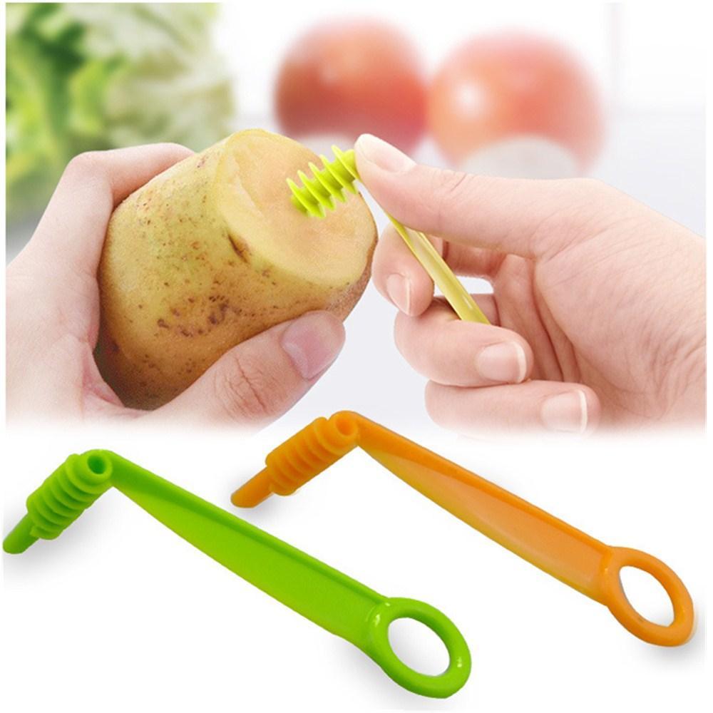 Plastic spiral vegetable cutter for creating decorative veggie spirals for salads and garnishes.