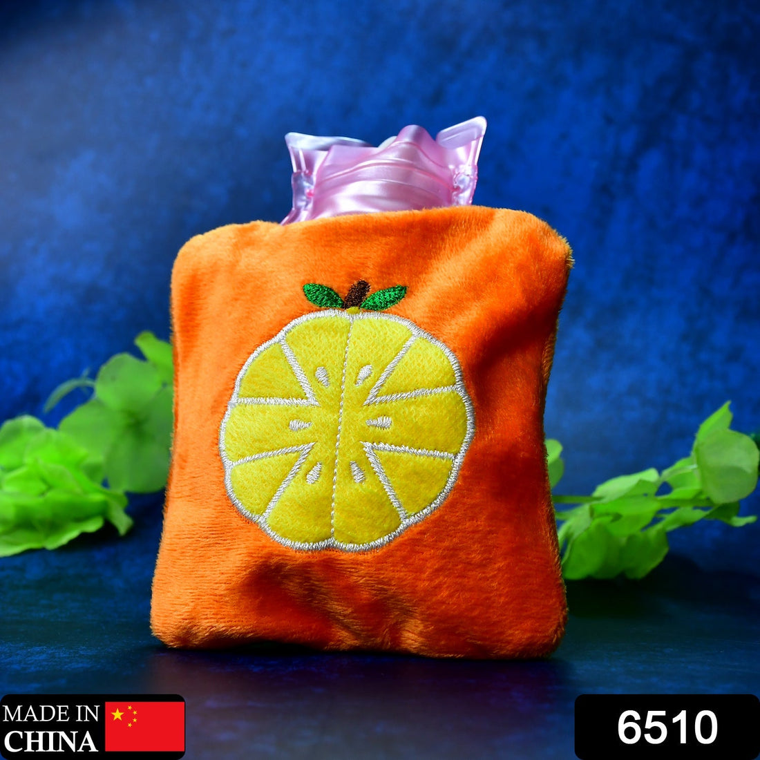 Orange hot water bag with cover for pain relief and warmth